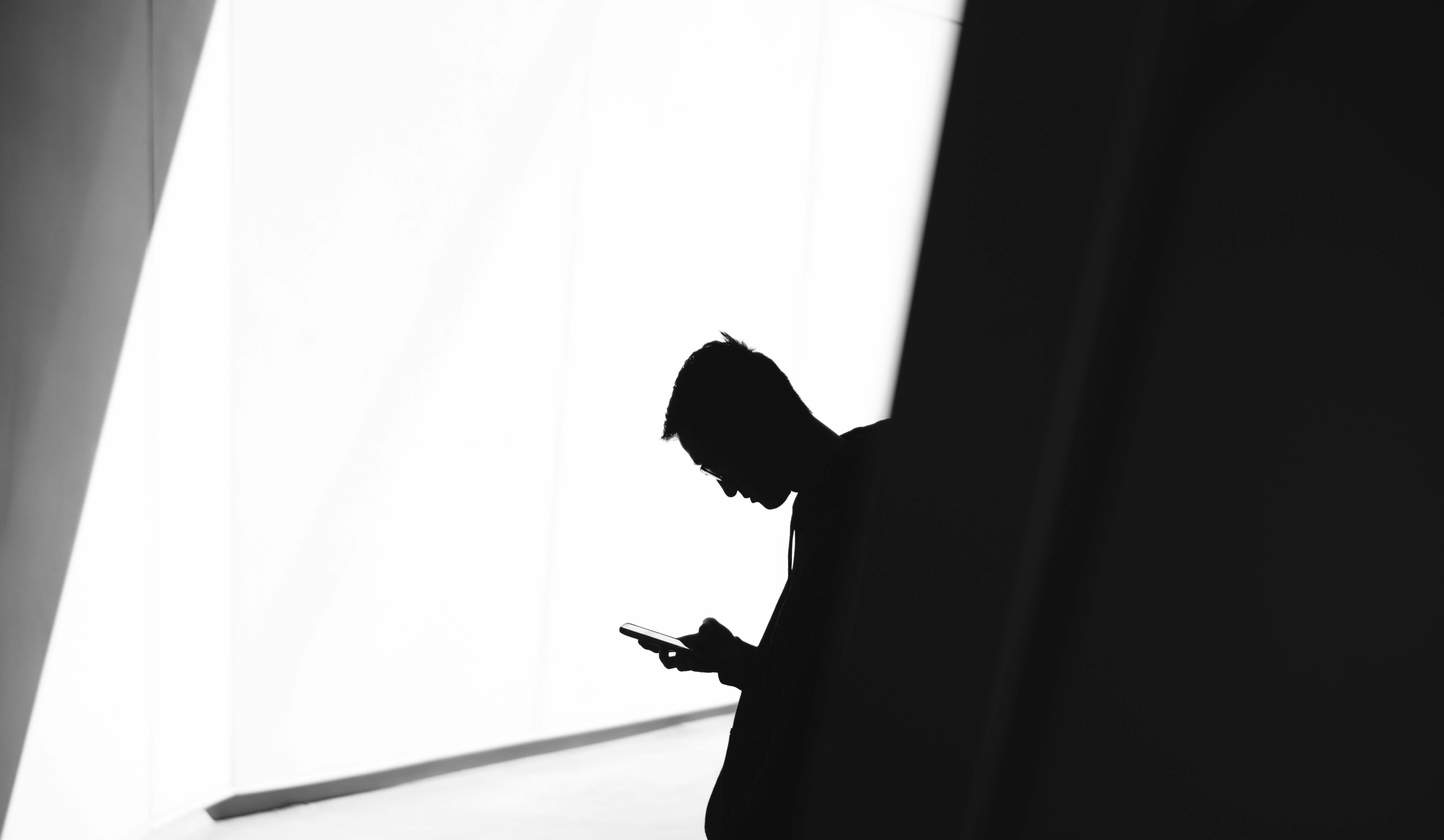 Blog 9  Person on Phone 1   by warren unsplash